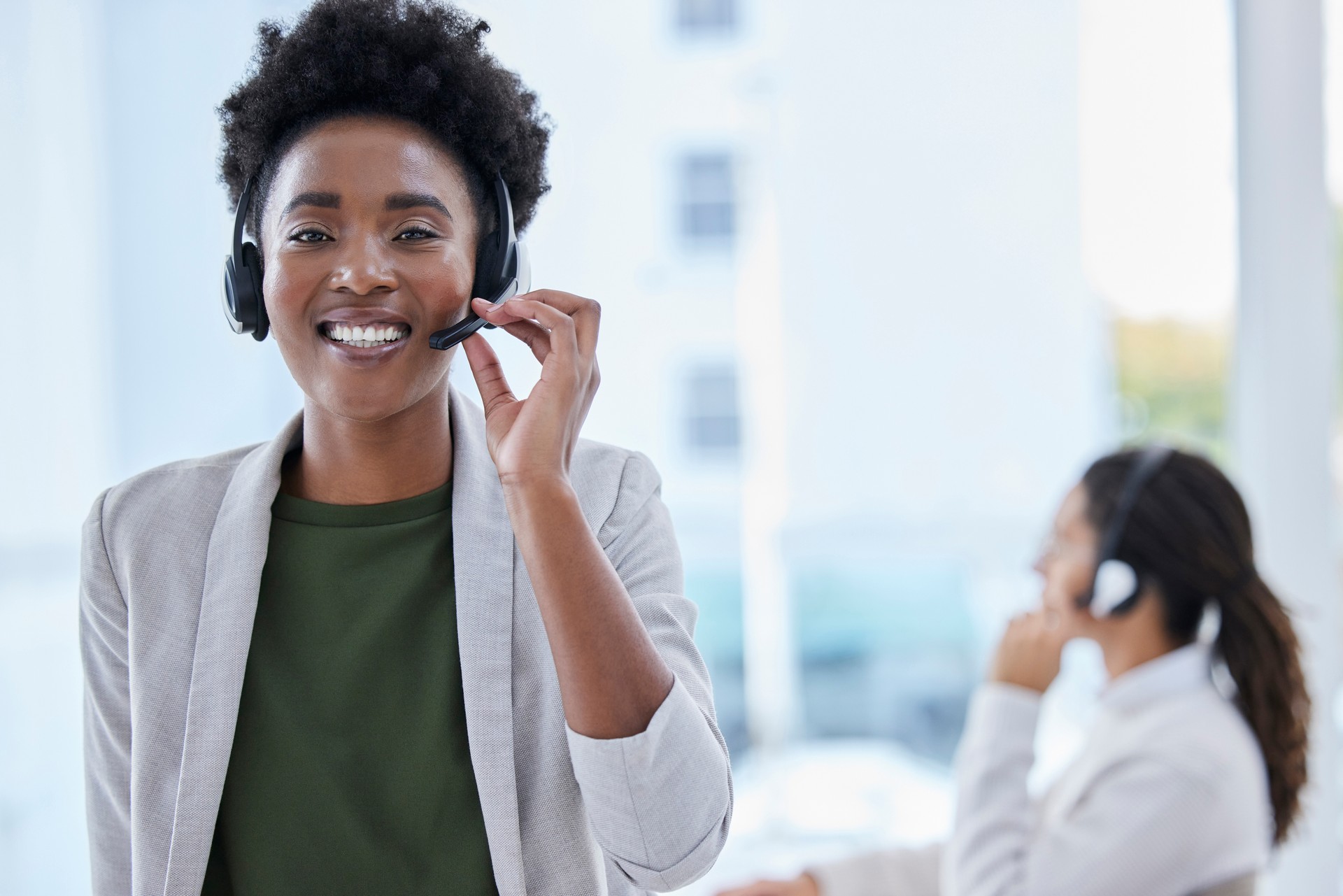 Call center, portrait and black woman in office for crm, telemarketing and customer service on blurred background. Face, lady or manager consulting for faq, about us or online support, help or advice